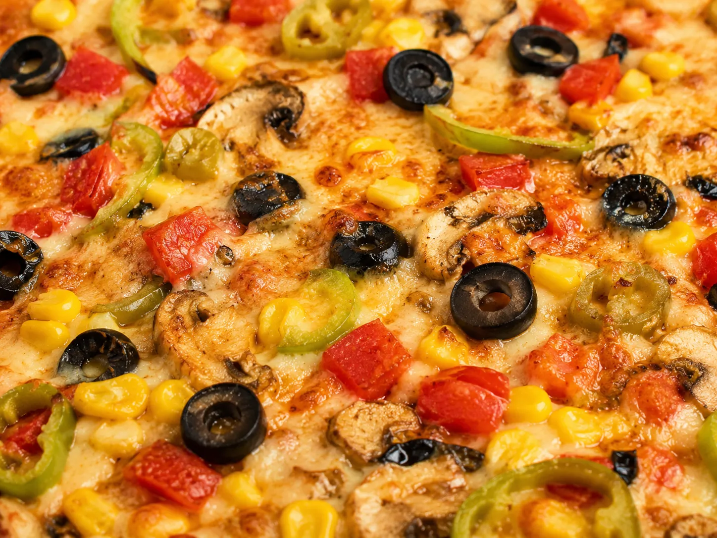 Cheese-loaded pizza with extra mozzarella and house-made sauce on hand-crafted crust at Oven Flames Pizza, Calgary NE